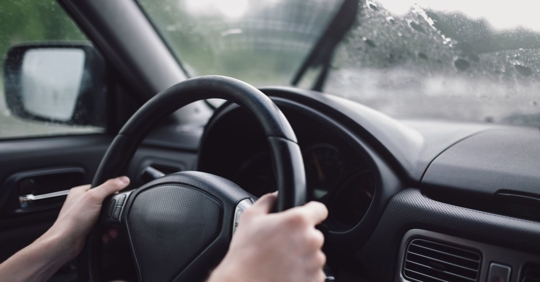 Woman driving in the rain