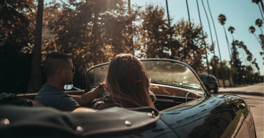 Florida tourists driving in a convertible